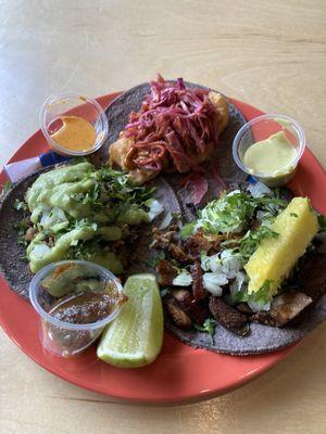 One taco suadero, one shrimp taco, and one taco al pastor