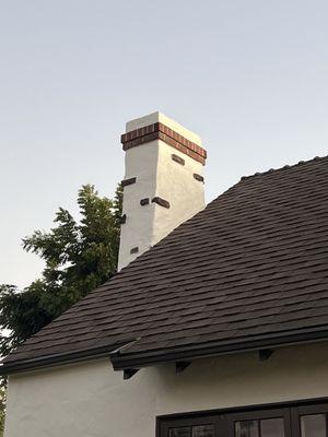 Stucco repair and painted chimney.