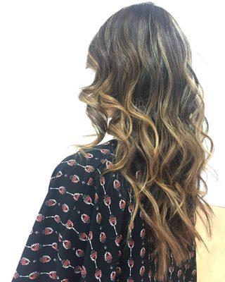 Balayage with bright blonde tips, large curls, tapered long layered hair by Brisa