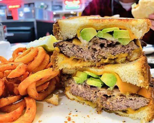 SF MELBURGER Grilled sourdough bread, a Melburger patty, cheddar cheese, bacon, avocado, grilled onion with Thousand Island dressing