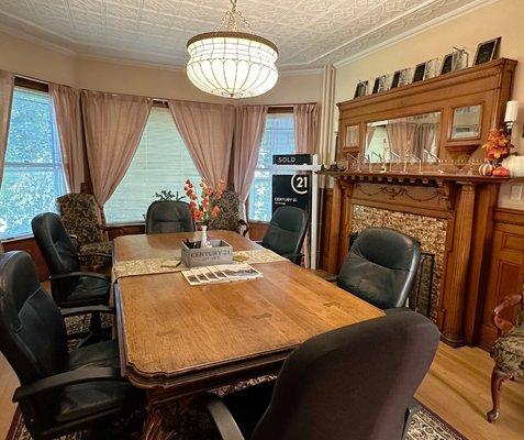 Inside the CENTURY 21 Advantage office- real estate service awards surround the beautiful conference room.