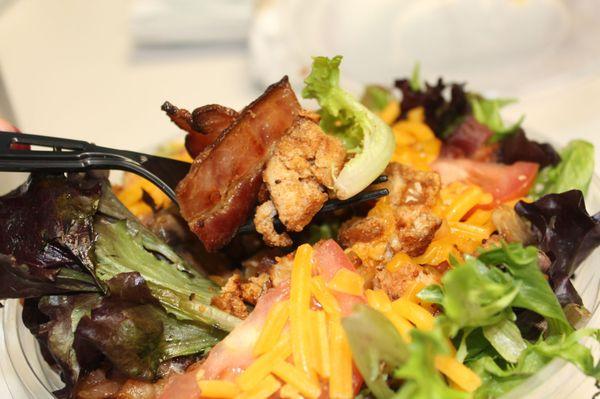 Bacon chicken salad.  Giant delicious bacon pieces. Next to Aces Nails & Spa.