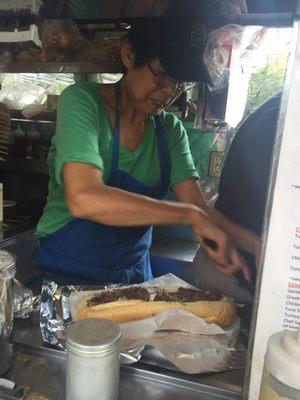 Linda preparing my cheese steak!