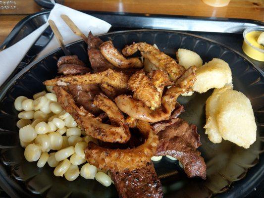 Two large size heart anticuchos, Rachi, (it was call choncholi when I was in Peru) Peruvian corn and additional side: salad, potatos, yuca.