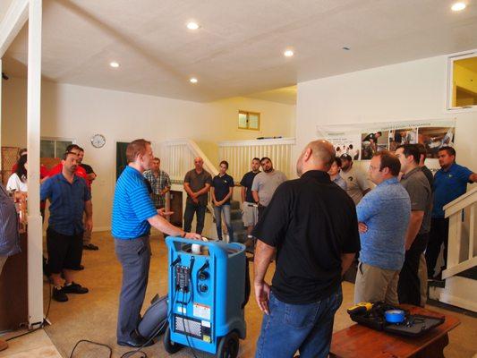 ASD class. Learning proper way to dry-out a flooded house. Flood house training on site at The Academy