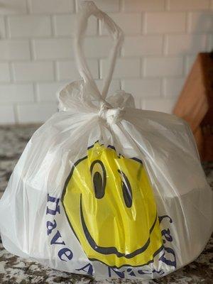 Cheery takeout bag tied with a perfect carrying handle!