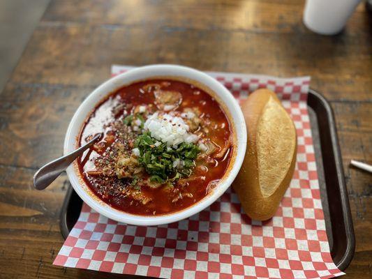 Menudo served with a fresh soft bolillo