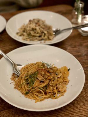 Tagliatelle Bolognese (back) and spaghetti with clams (front)