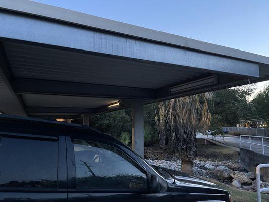 Lights above the paid parking spots before they were fixed