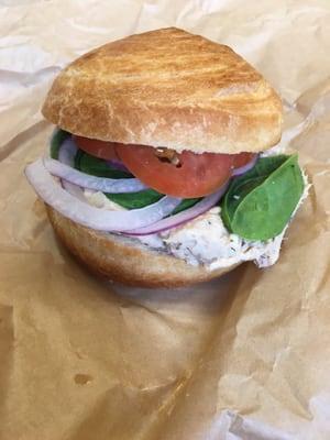 Albacore Tuna Croissant -- House made tuna salad, diced eggs, red onion, tomato, and spinach on a croissant roll