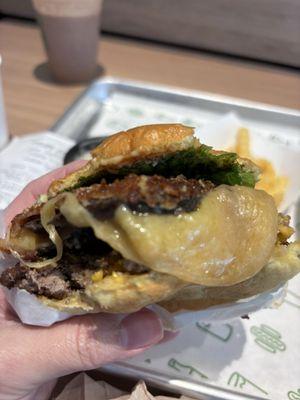 Shack stack cheese oozing out of the mushroom patty