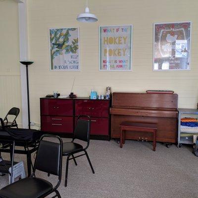 The classroom, including a Yamaha upright piano.