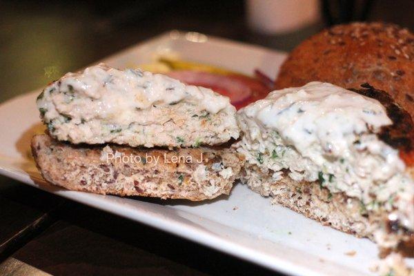 Inside of Spinach and Feta Chicken Burger ($16) - Chicken patty mixed with crumbled feta and fresh spinach topped with cucumber yogurt sauce