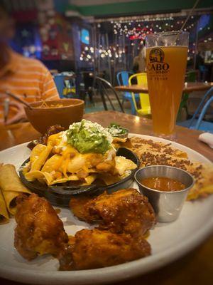 Appetizer Sampler and tall souvenir glass of cerveza