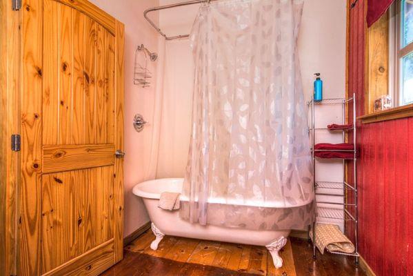 Upstairs 2-Queen Suite has full bath with clawfoot shower/tub.