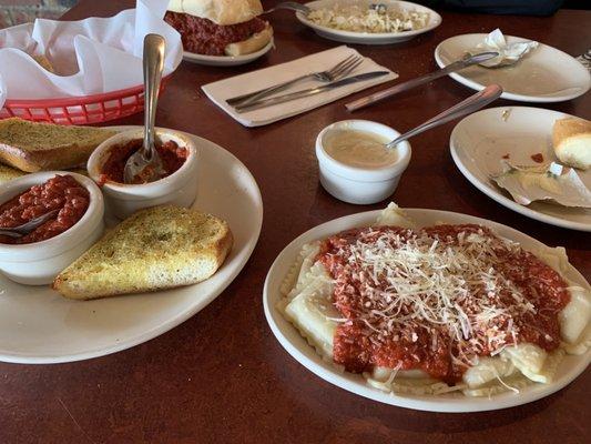 Ravioli in meat sauce with garlic bread.