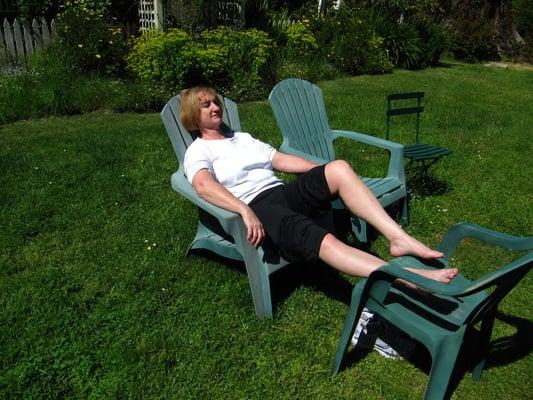 After a hike, Cecelia relaxing in the garden (Memorial Day weekend, 2010)