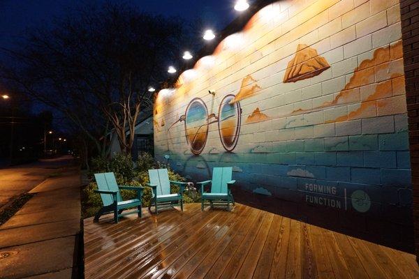 Eclectic Eye at night with Kyle Taylor's Mural.