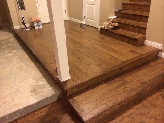 A solid 14 Ln ft hickory stair-nosing scraped and stained to match this Anderson Hardwood floor.