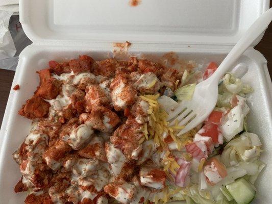 Salad, Chicken over rice with white sauce and hot sauce.