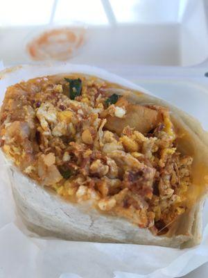 Tasty & big chorizo breakfast burrito w a salsa that had a good kick.