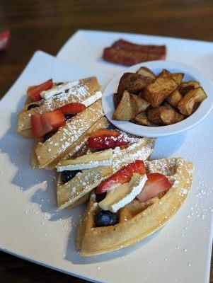 Waffles with brie & fruit compote, breakfast potatoes and andouille sausage.