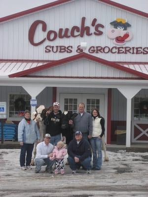 Couch Family in front of Store