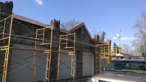 New facade constructed on 1900's circa stone garage. New copper coping and soffit fabricated and installed by the Brew Crew.