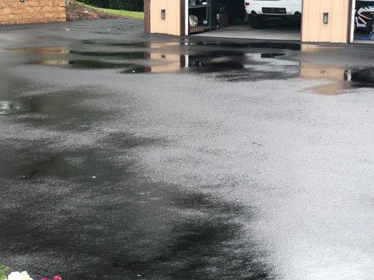 The puddles right outside my garage door- gets icy in winter we have to sweep the puddles !!! Sanatoga Paving done 06/21not repaired yet