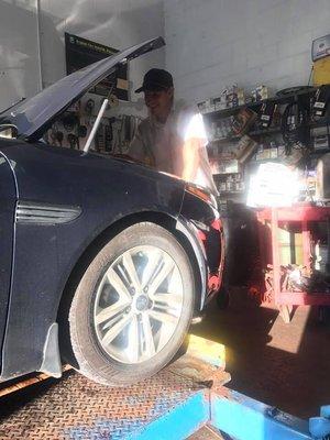 Young Gary doing an oil change