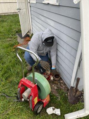 Rooting out a backed up sewer line