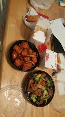 delivery beef broccoli & orange chicken with fried rice and egg rolls