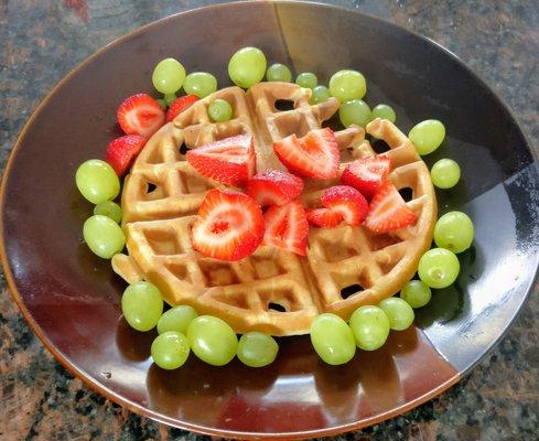 A balanced breakfast: whole grain buttermilk waffles and fruit.