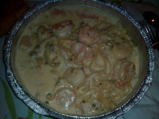 Fettucini alfredo with shrimp, scallops, and clams. Huge portion and delicious!