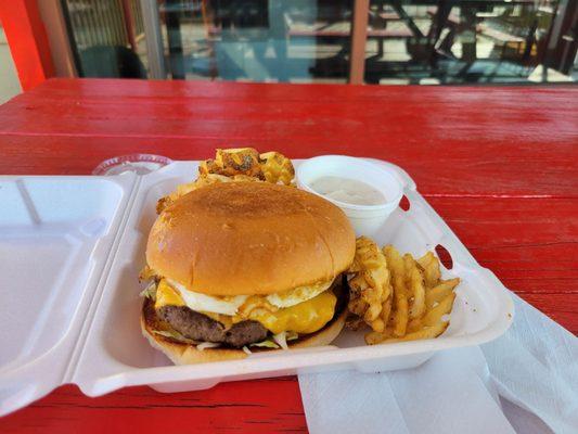 Hangover burger with jalapenos added and a side of waffle fries w/gravy