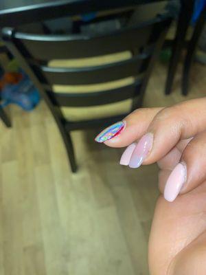 A nail that is supposed to be completely covered with chrome.