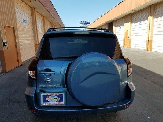 Finished product on Toyota Rav 4 full tint & smoked out taillights.