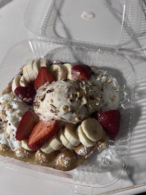 Bubble Waffle with Ice Cream Flat with chocolate sauce, almonds, pecan ice cream, strawberries and banana. Oh and whipped cream on top!