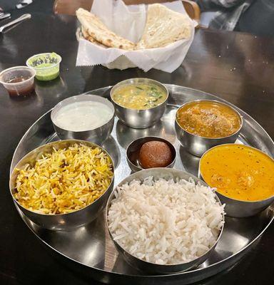 NON - VEG THALI - Chicken tikka masala, Lamb curry, Dal fry, Raitha, Rice, Plane Biryani Rice, Naan, Gulab Jamun.  With Garlic Naan bread.