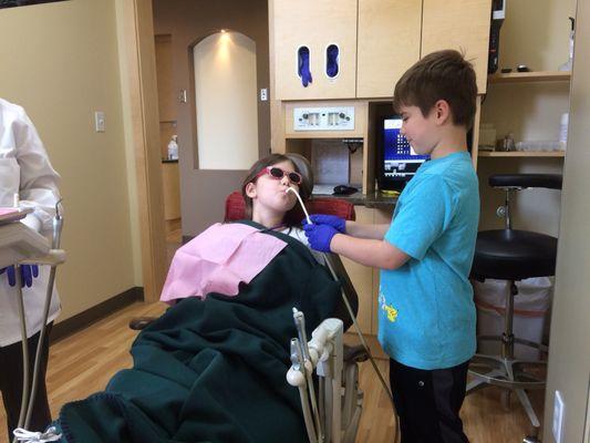 My son "assisting" with Mr. Thirsty the water suction on his sister's visit.