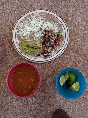 Complimentary salsa, rice and beans and guac and limes