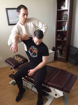 Dr. Ryan Hamilton utilizing Active Release Technique to treat the upper back.