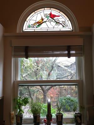 The gorgeous stained glass panel Pam created for us. I love it!! I have actually caught cardinals sitting in the tree admiring it too :)