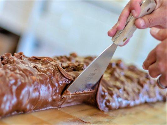 Setting the fudge up...Aaron Murdick makes the fudge into a long loaf to cut and put into the showcase.