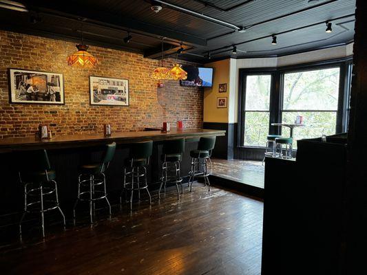 Upstairs seating and bar