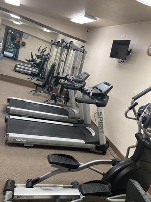 Gym with many options, also there were nice free weights. Spring water and cups, a scale, TVs. Open til 11 pm!