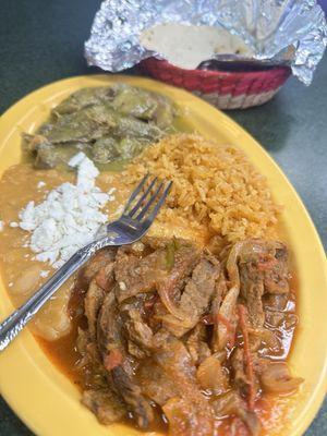 choice of 2 items plus rice beans and tortillas .