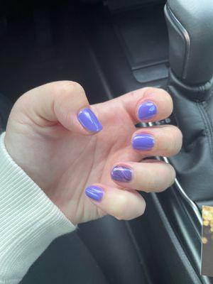 Purple gel nails with cat eye accent nail.