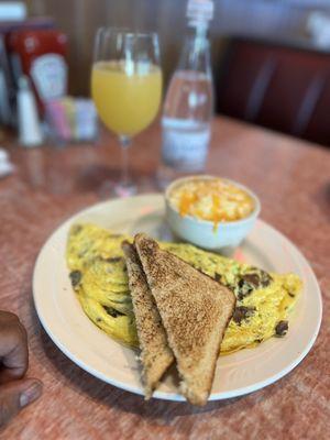 Omelet with mushrooms, spinach, provolone cheese with white toast.