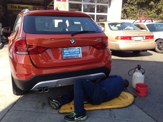 Haile, the friendly repair guy, fixing our tire